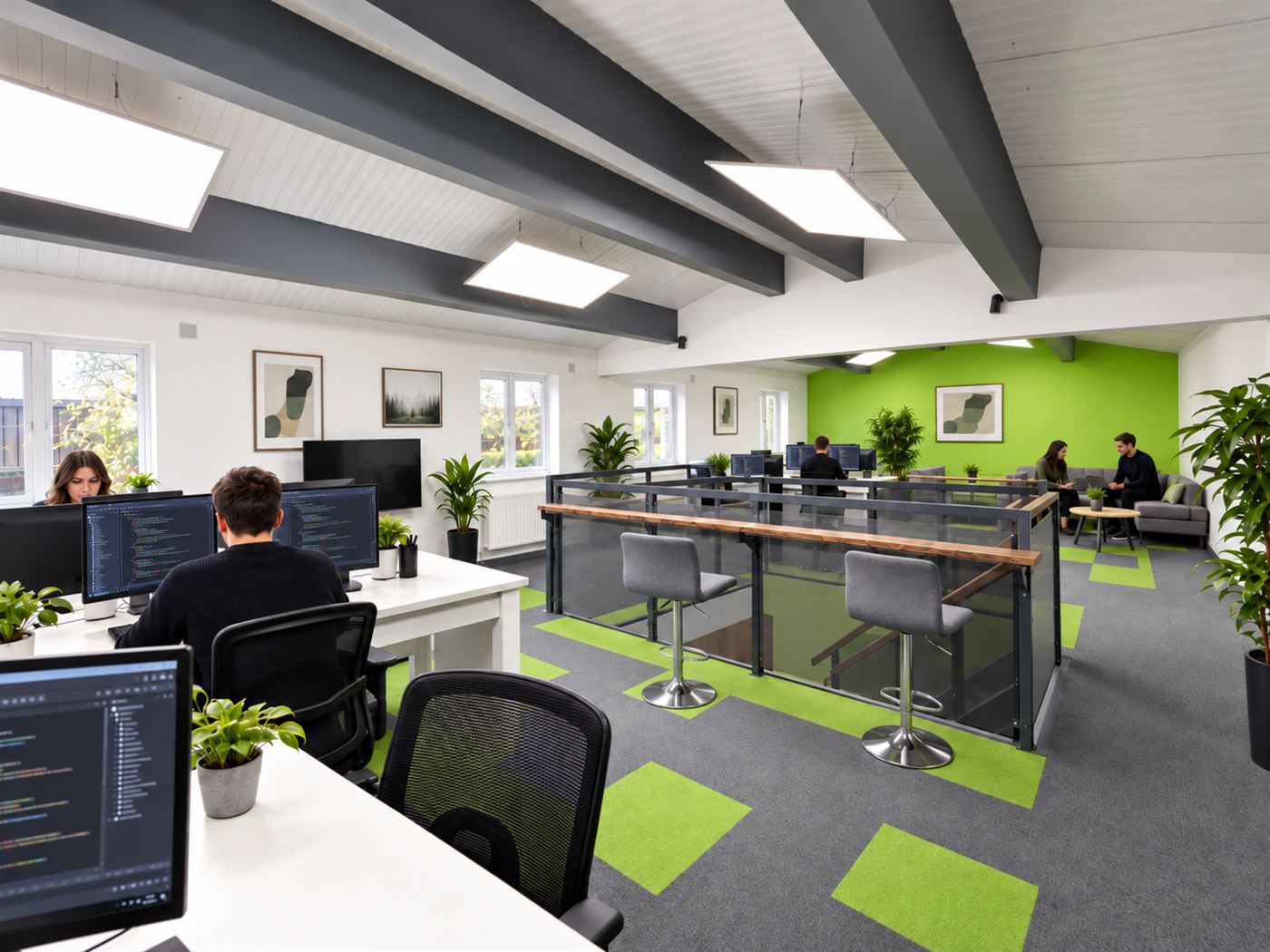 Open-plan coding floor with developers at their desks